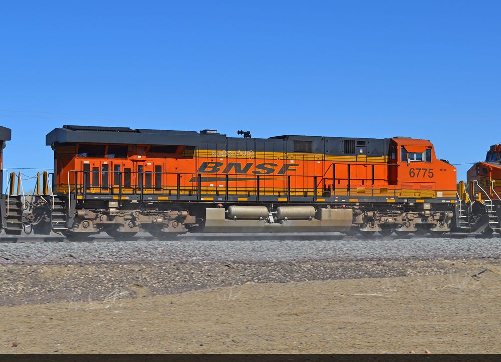 BNSF 6775 also helps churn up the ballast dust